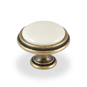 כפתור בקוטר 35 ממ פורצלן חלק שנהב-ברונזה עתיקה